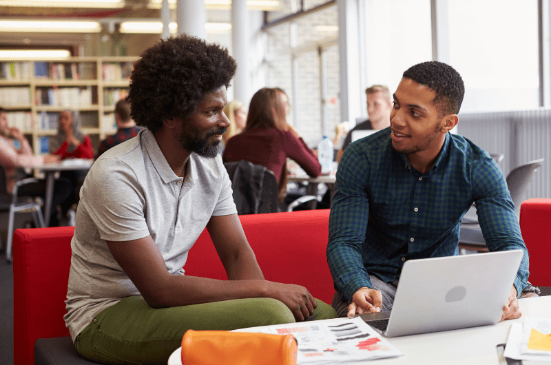 tutor and student at laptop